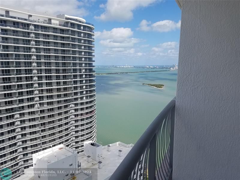 a view of balcony with furniture