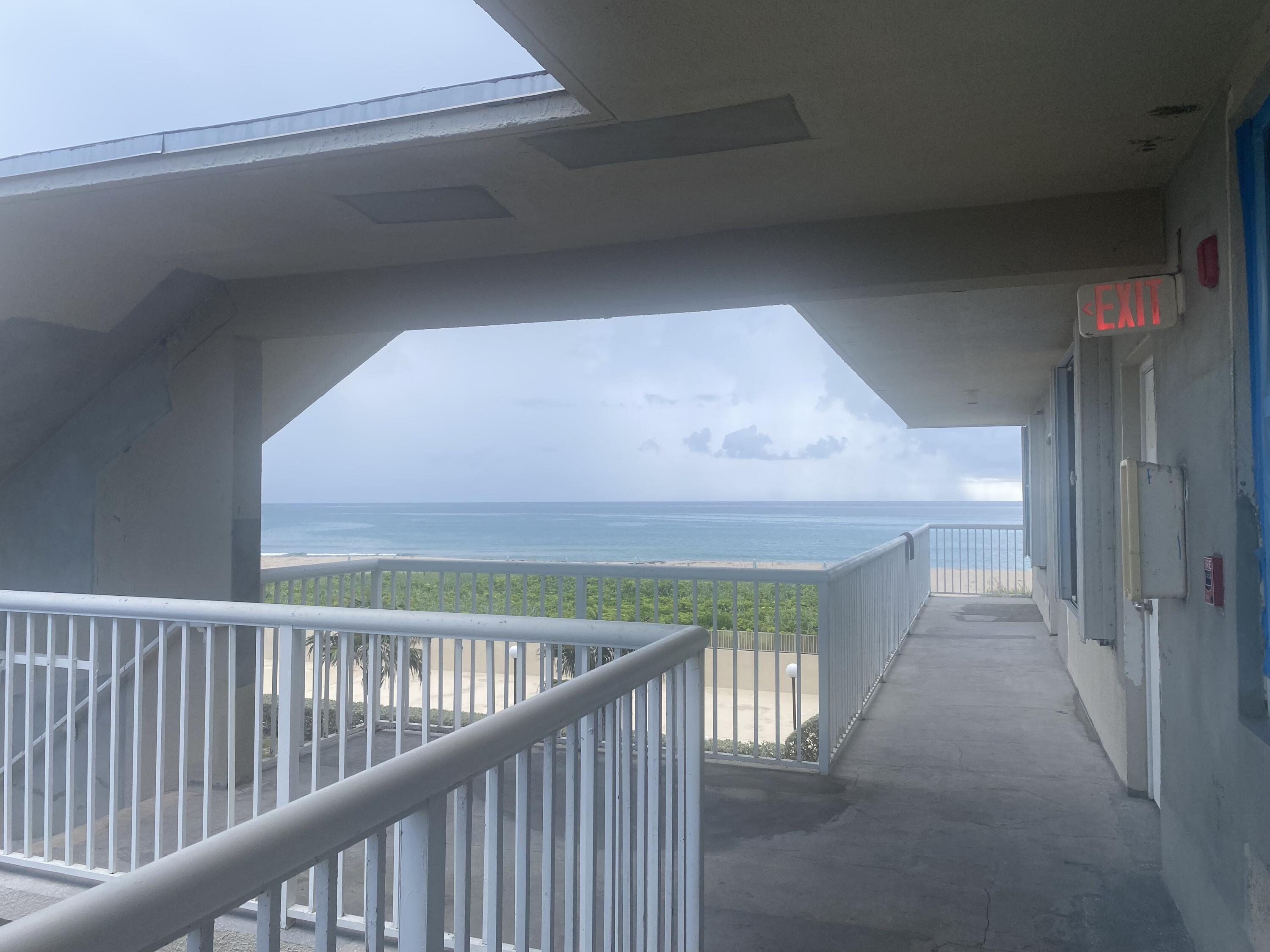 a view of a hallway view with staircase