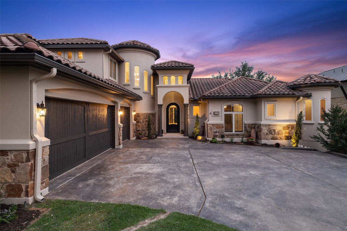 a front view of a house with parking space