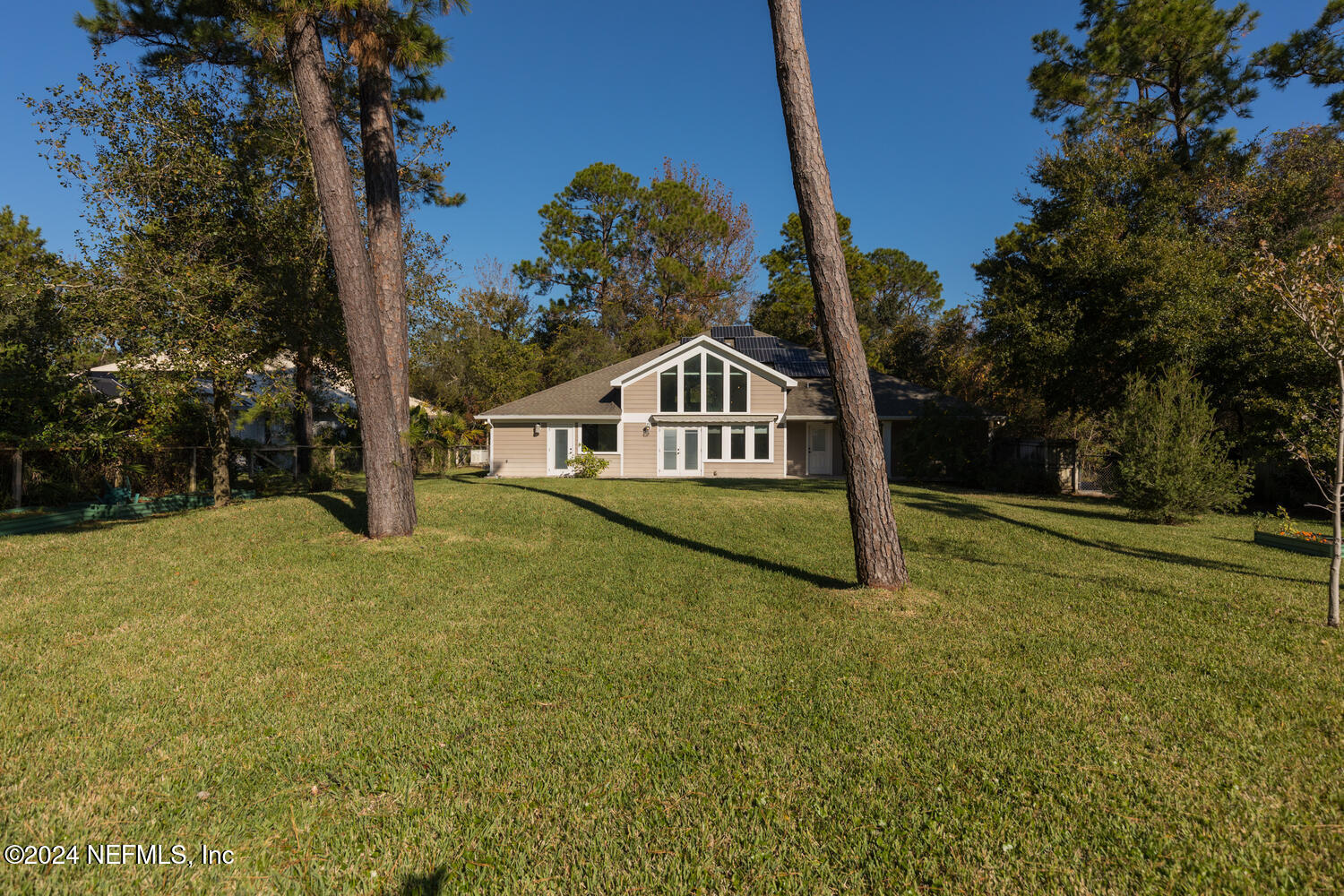 a house with trees in the background