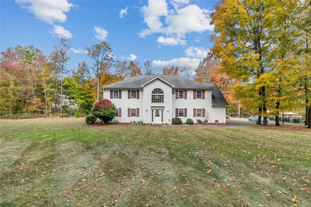 View of front of house with a front yard