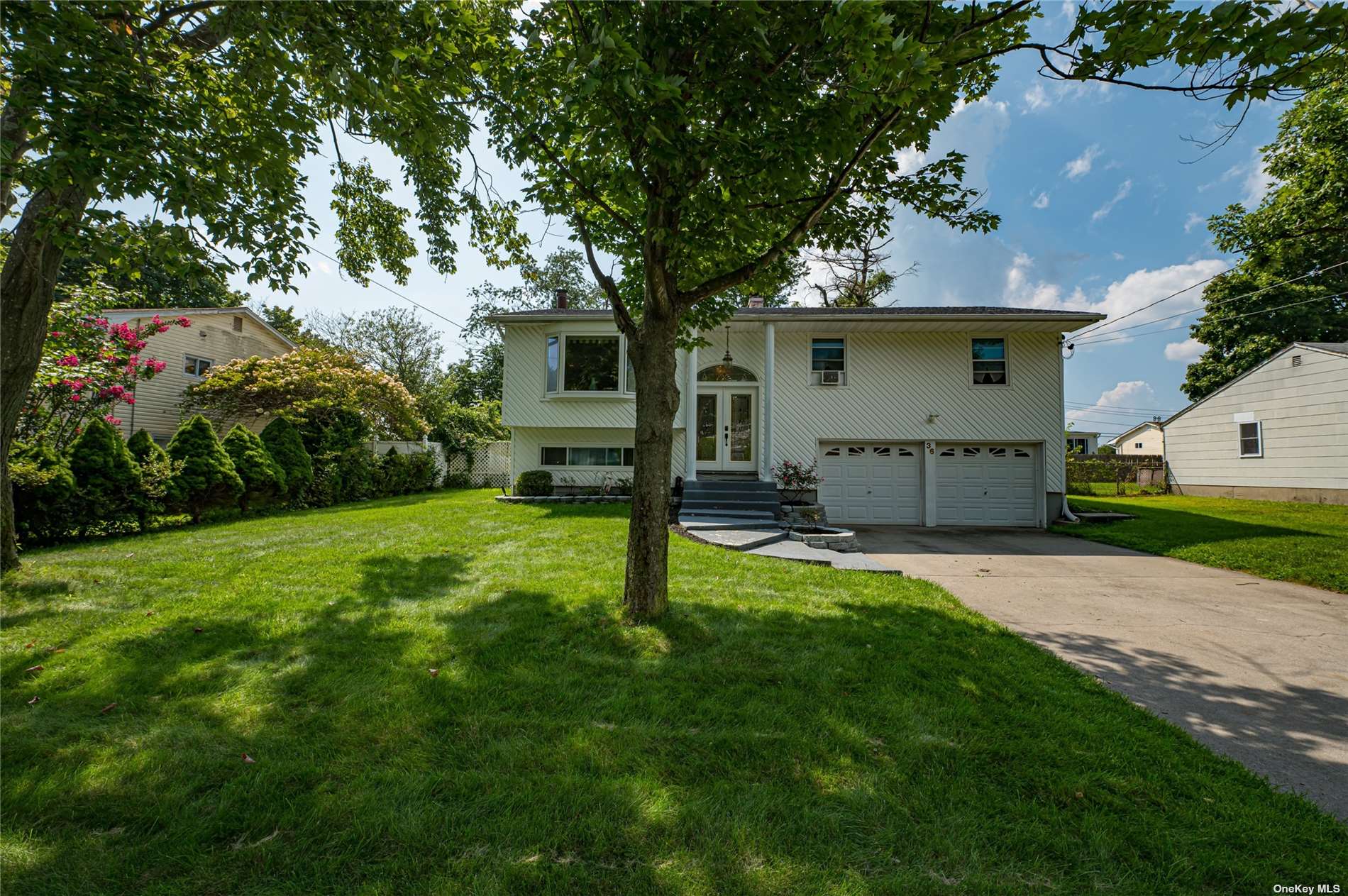 a front view of a house with garden