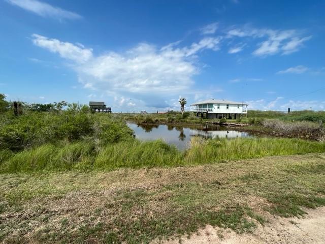 a view of lake with houses in the back