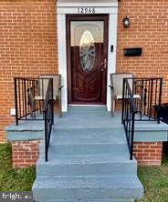 a front view of a house with a door