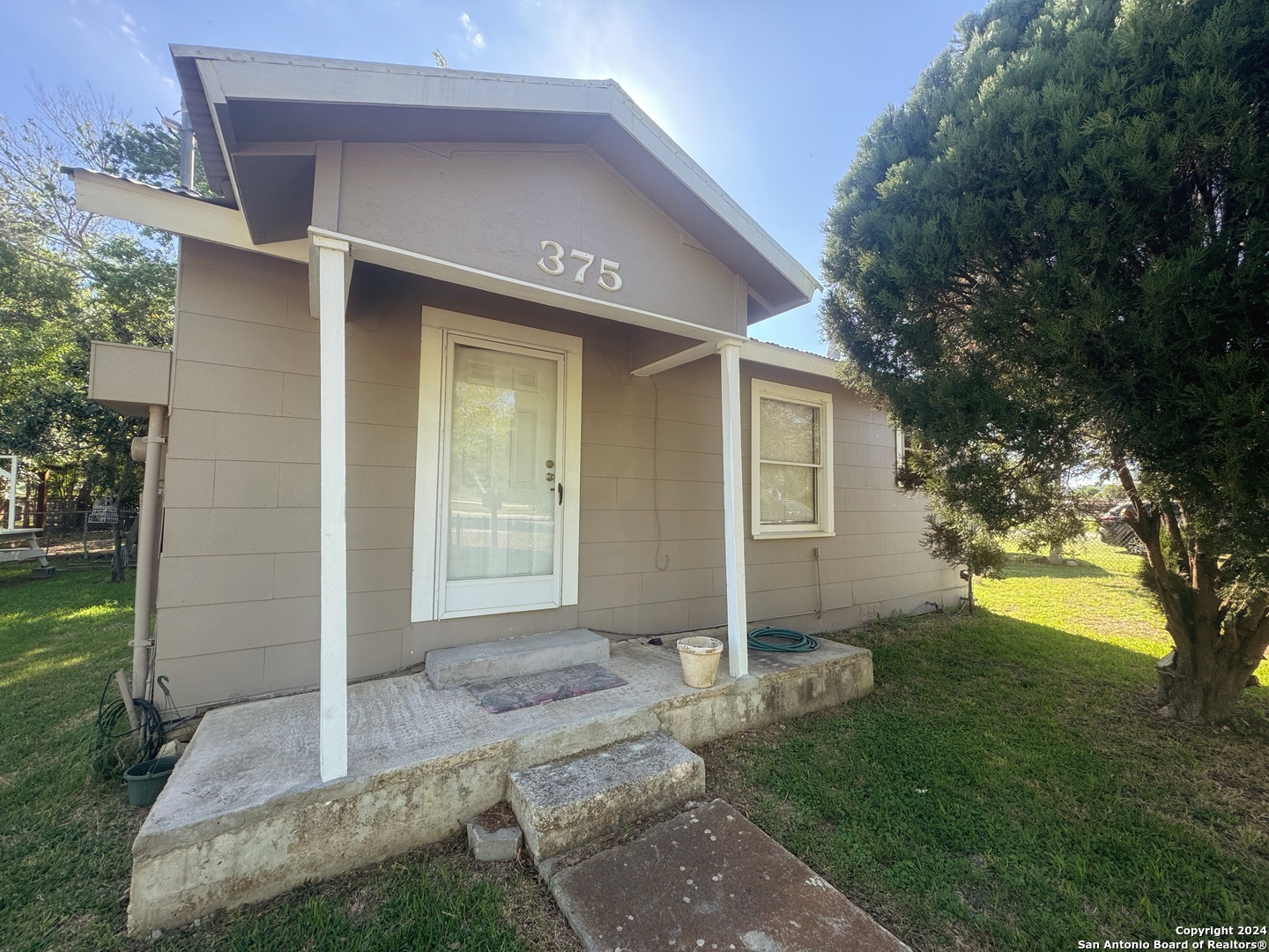 a front view of house with yard