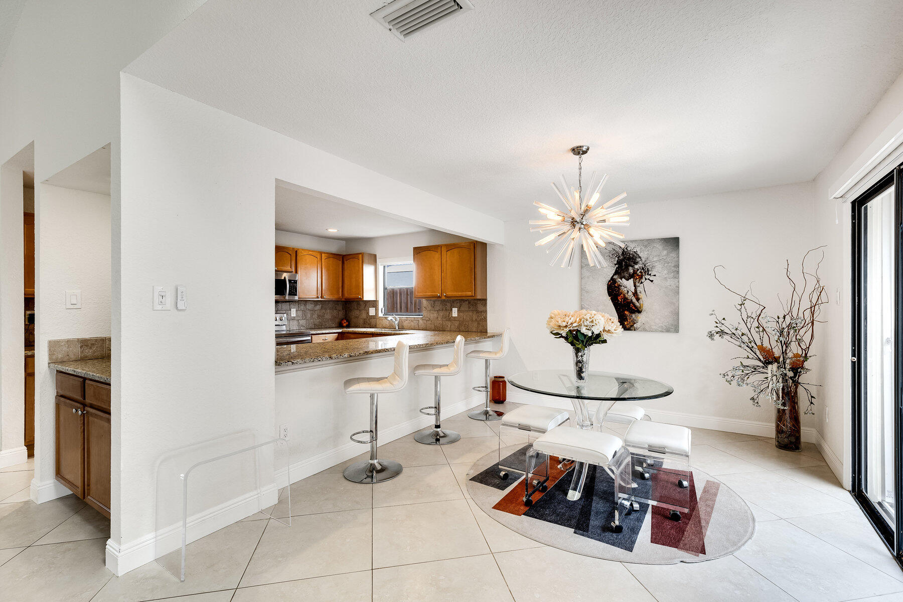 a kitchen with stainless steel appliances kitchen island granite countertop a sink and cabinets