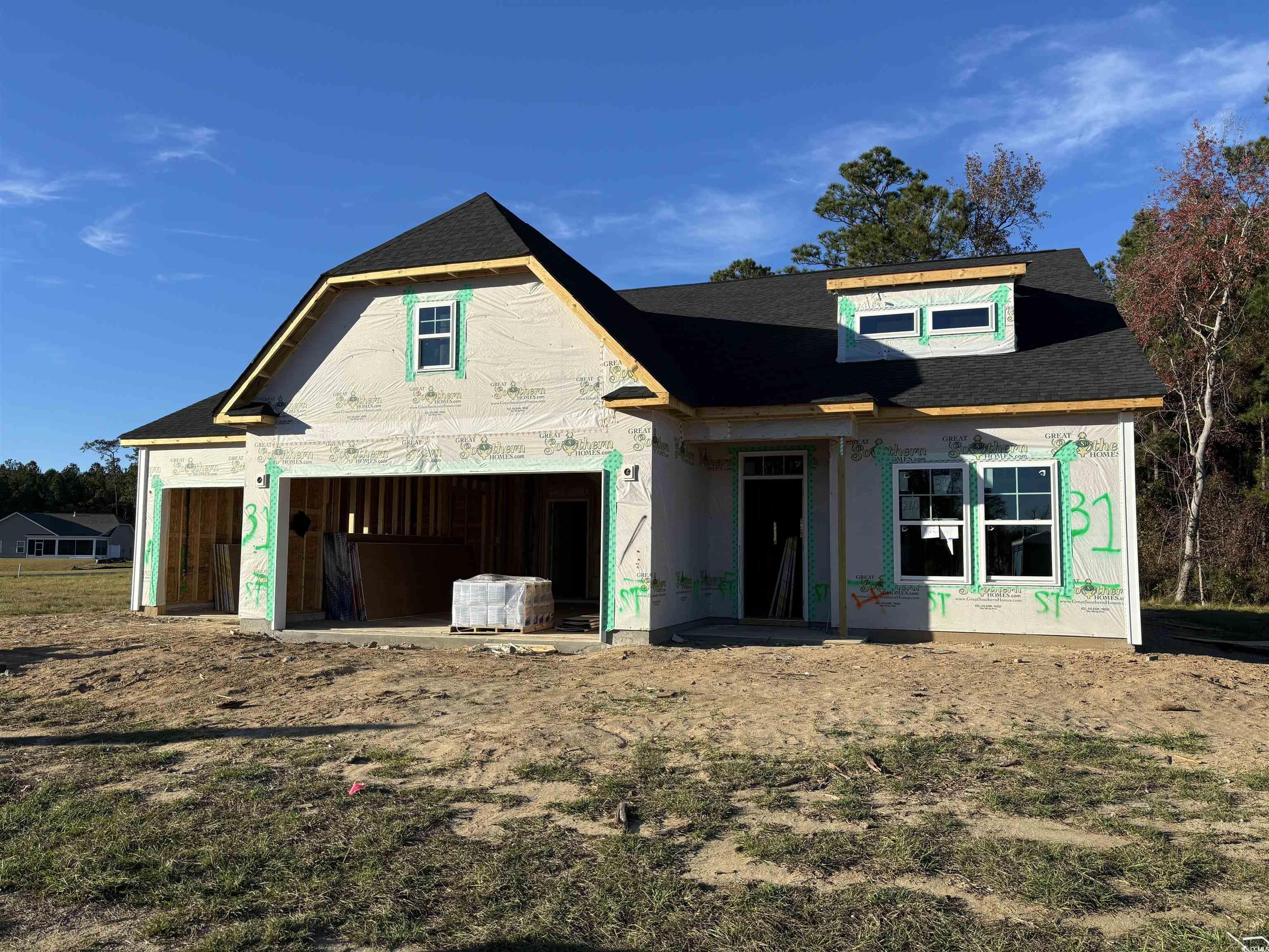 Property under construction with a garage