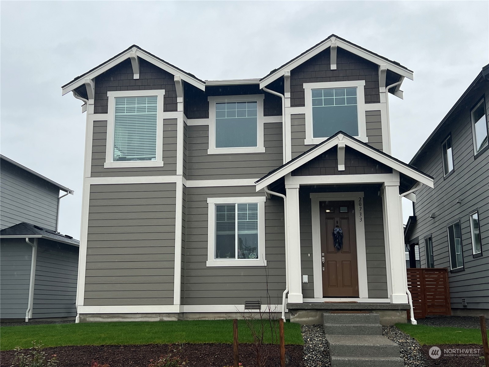 a front view of a house with a yard