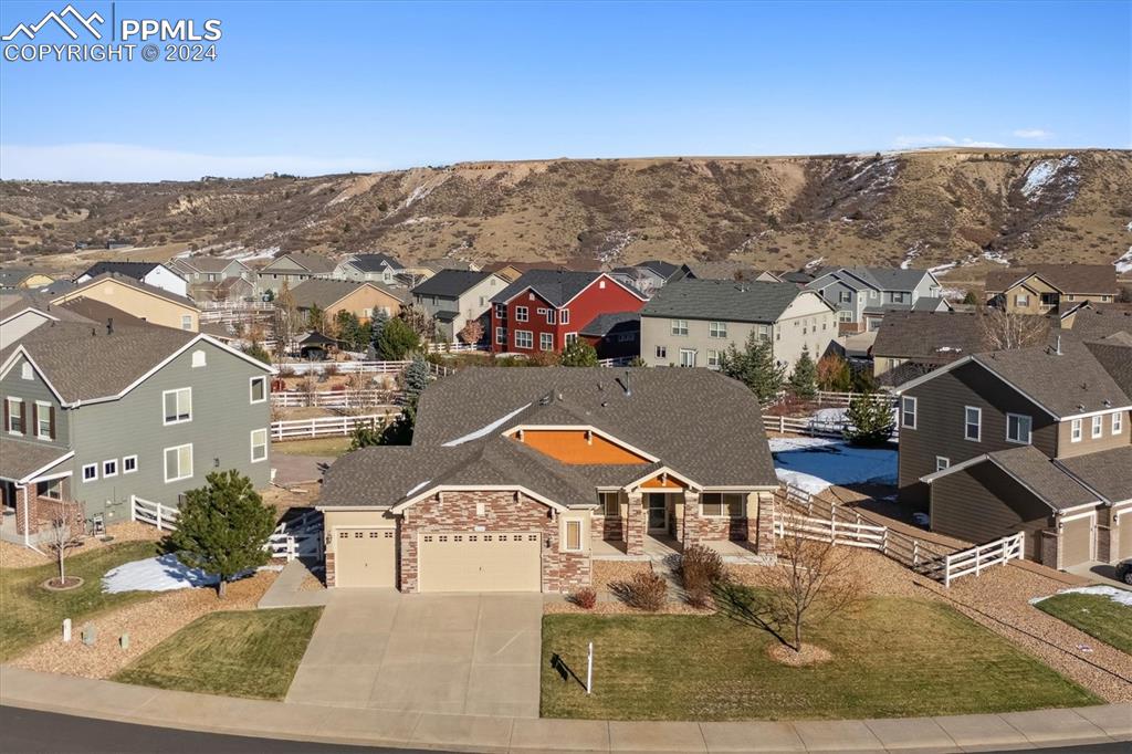 an aerial view of residential houses with outdoor space