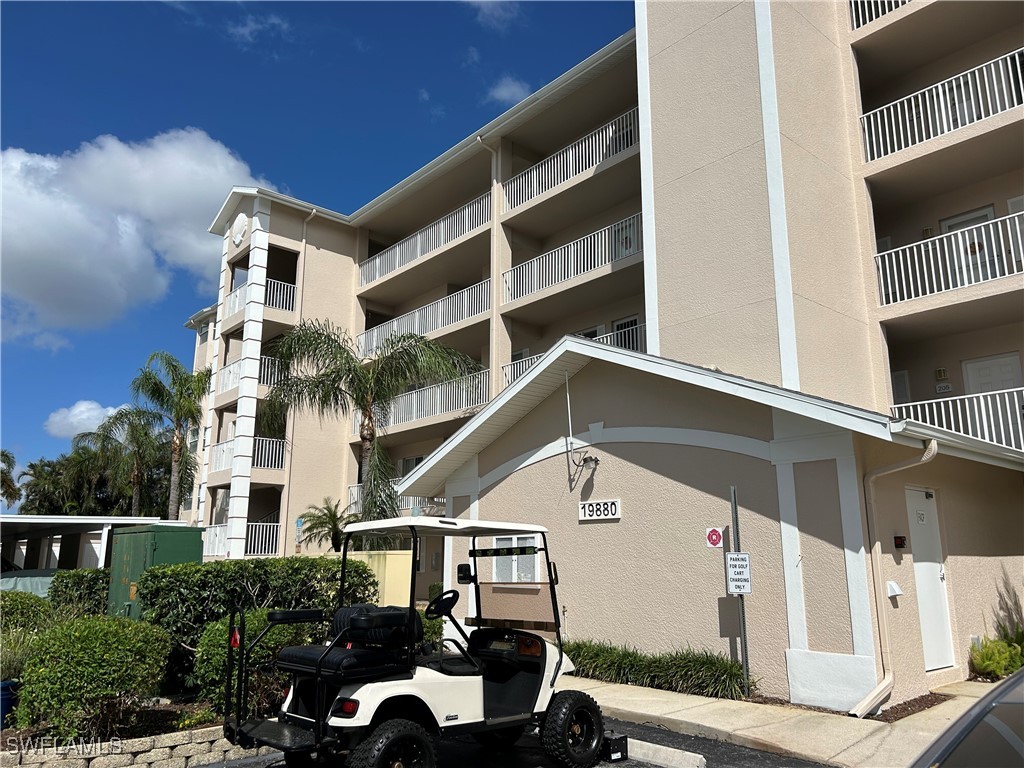 a front view of a building with parking