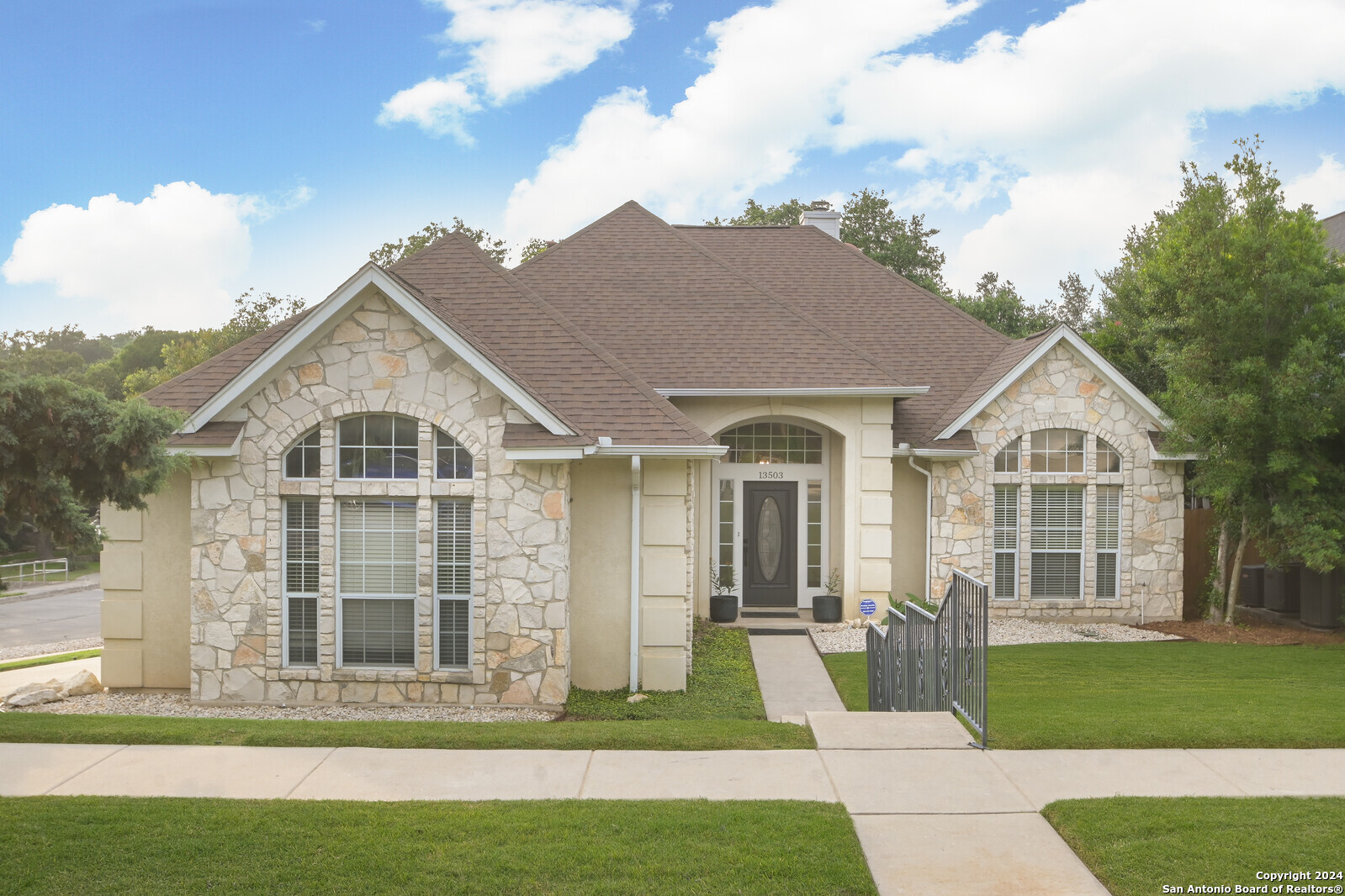 a front view of a house with a yard