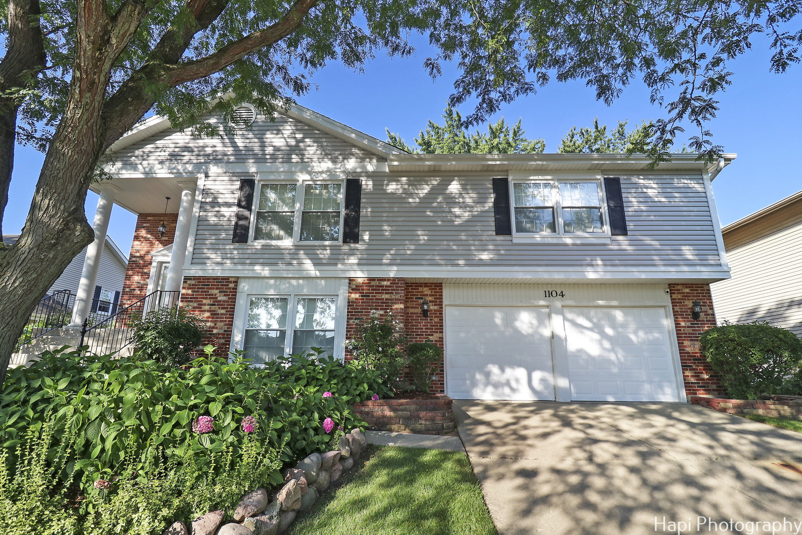 front view of a house with a yard