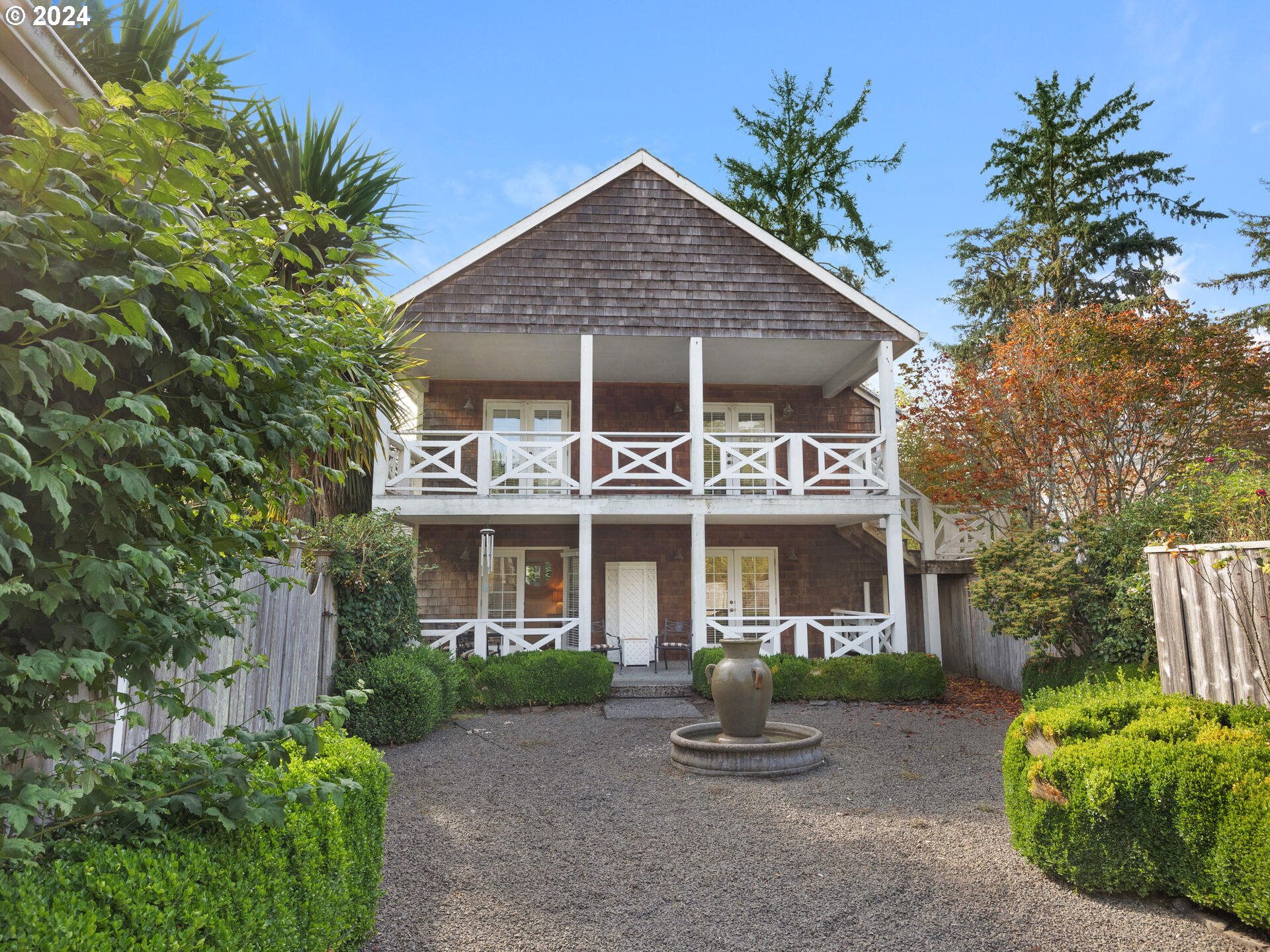 a front view of a house with garden