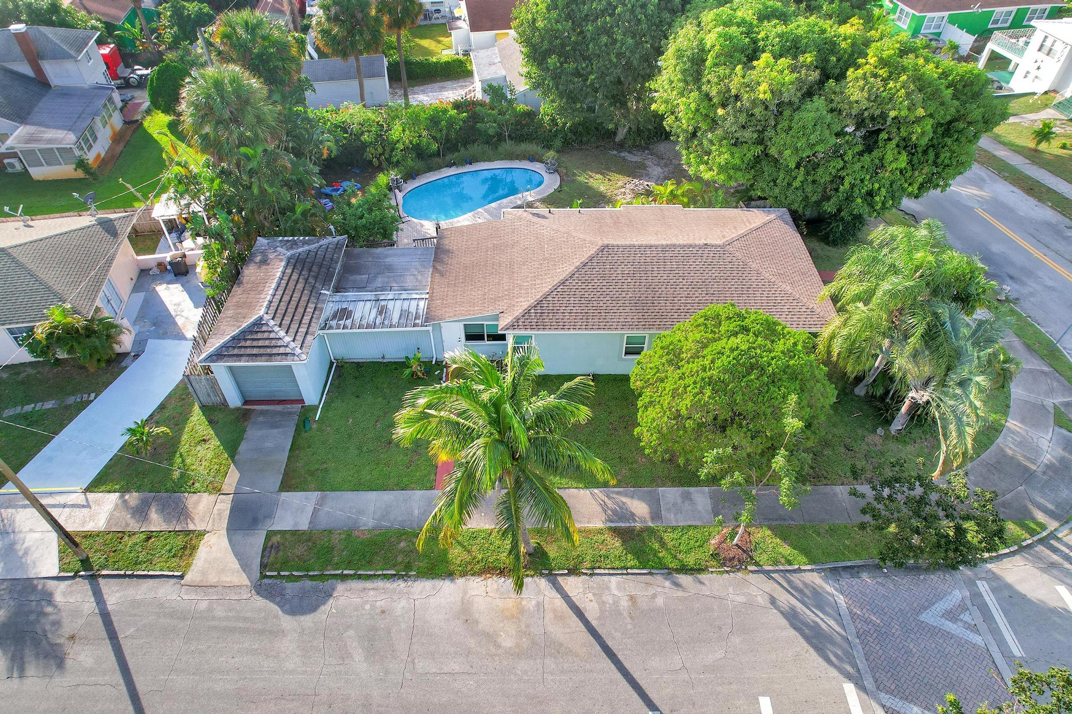 an aerial view of a house with a garden and plants