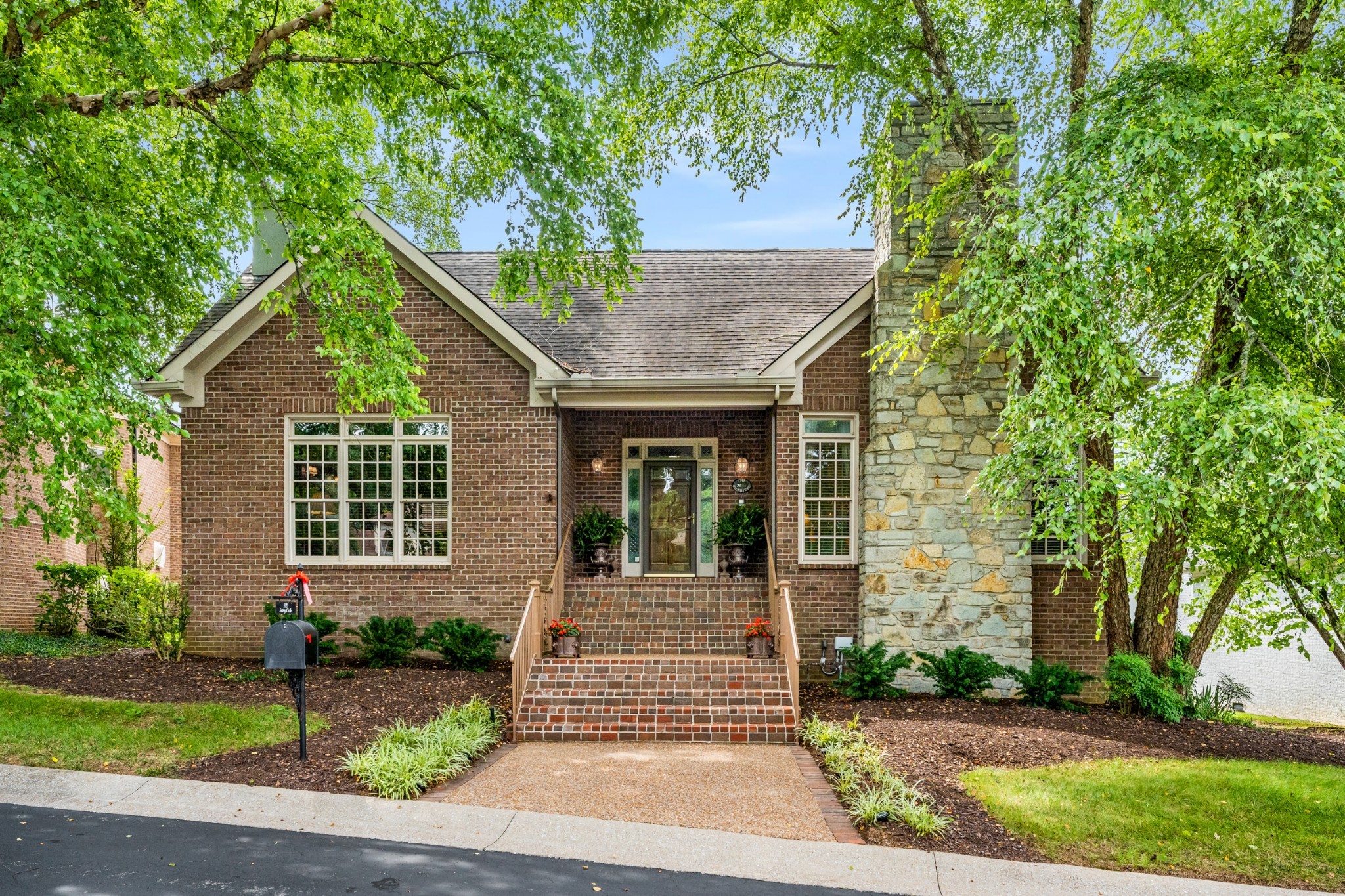 front view of a house with a yard