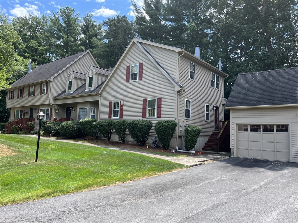 a view of a yard in front view of a house