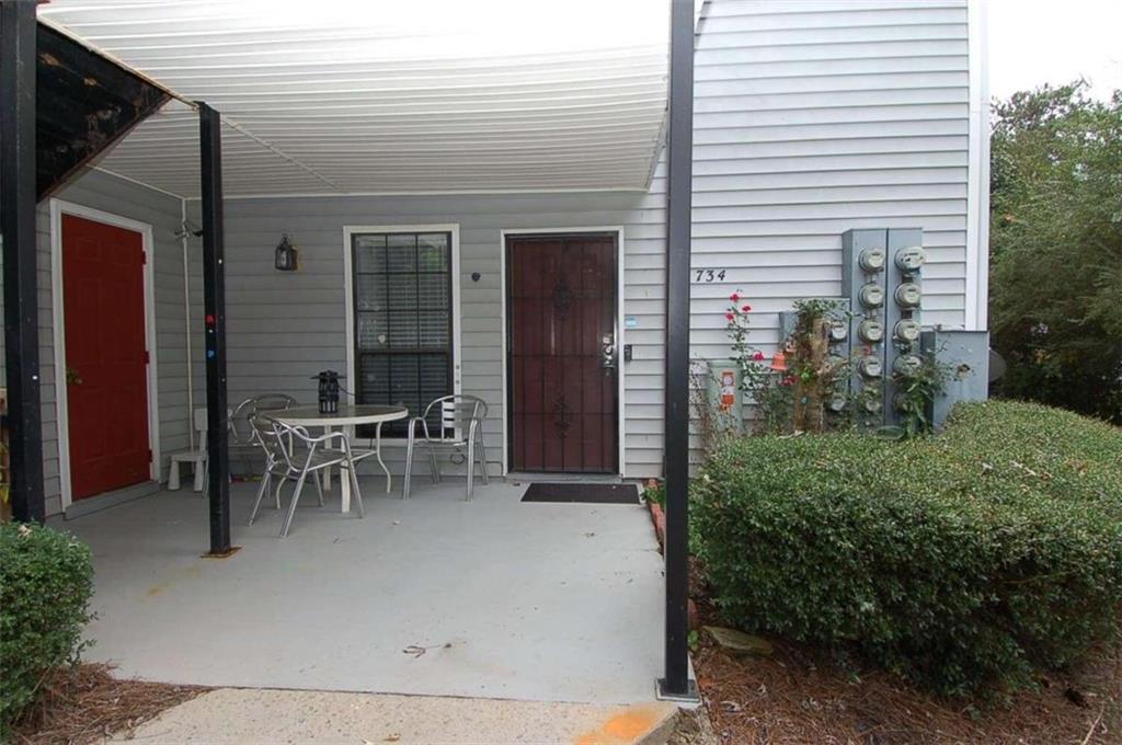 a view of a outdoor space with table and chairs