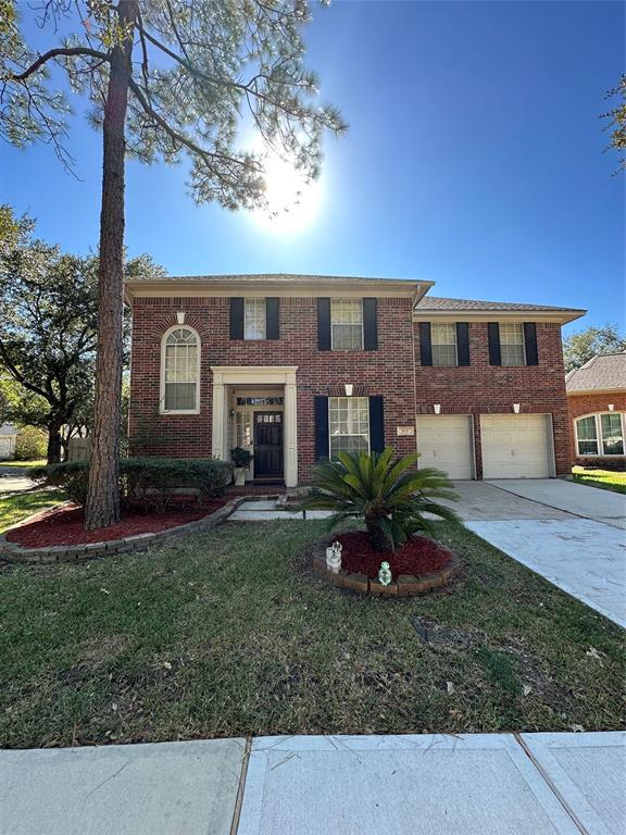 Front view of the house. Double drive way.