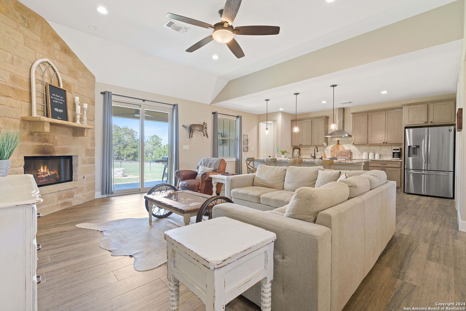 a living room with furniture and a fireplace