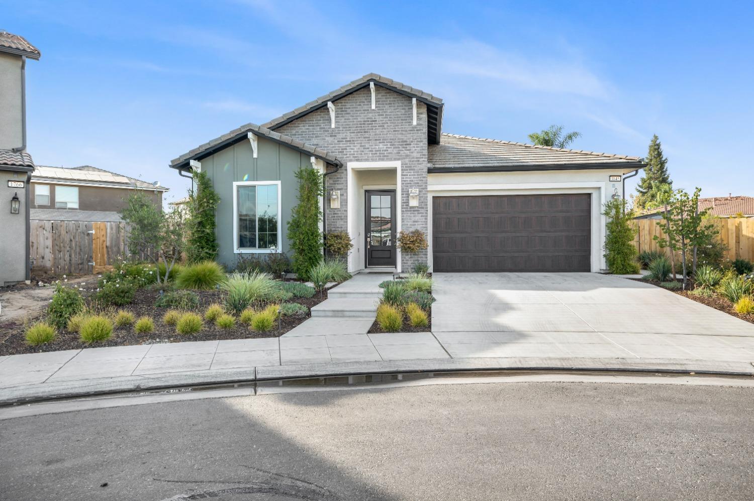 front view of a house with a small yard