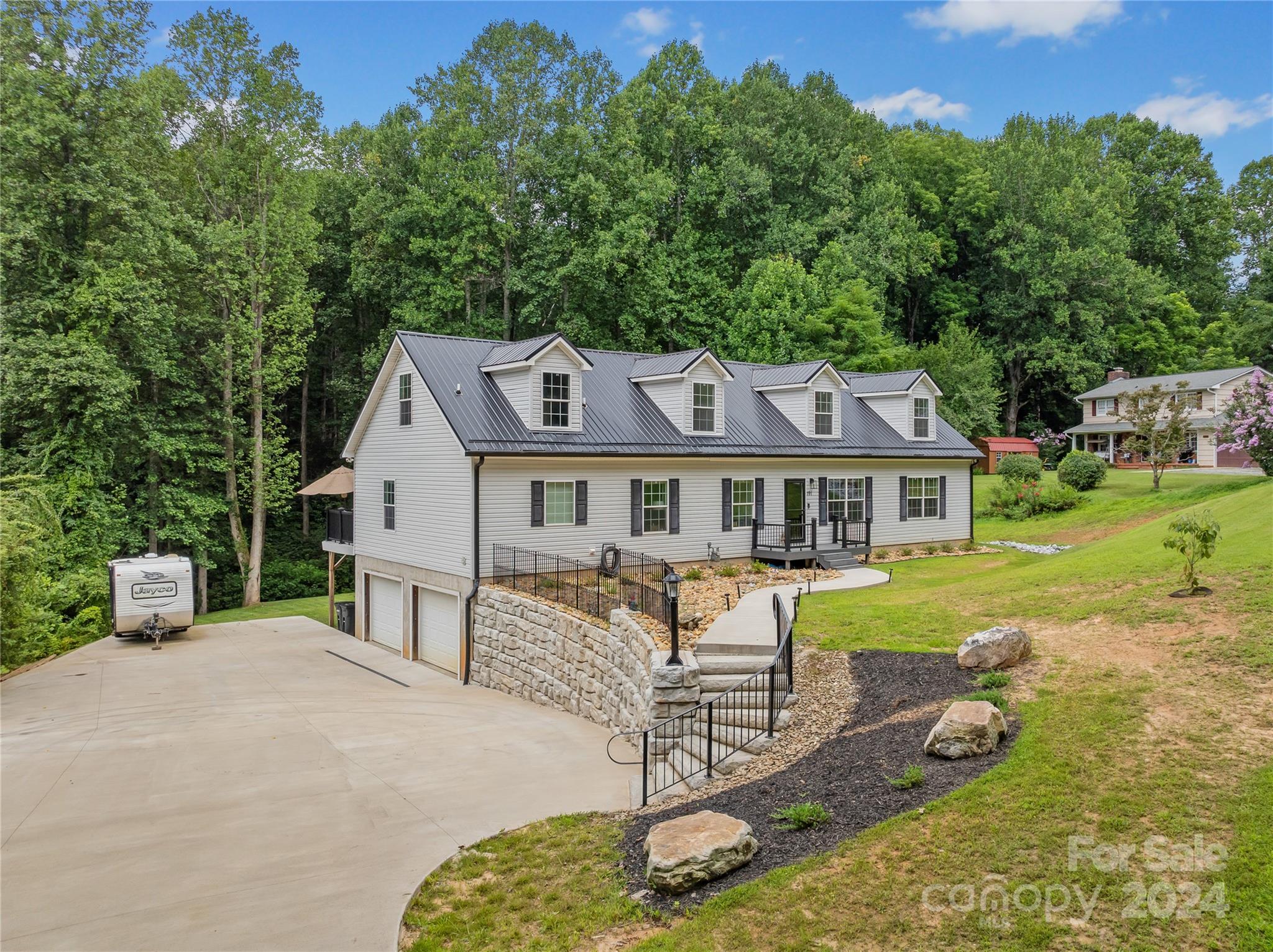 a aerial view of a house with swimming pool and porch