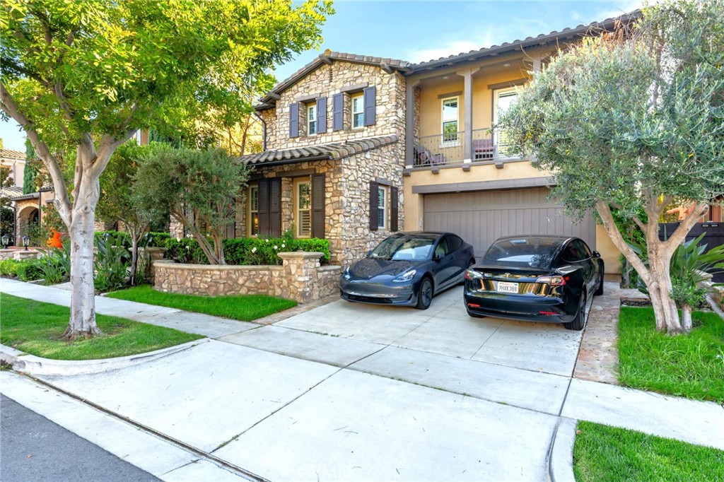 a car parked in front of a house with a yard