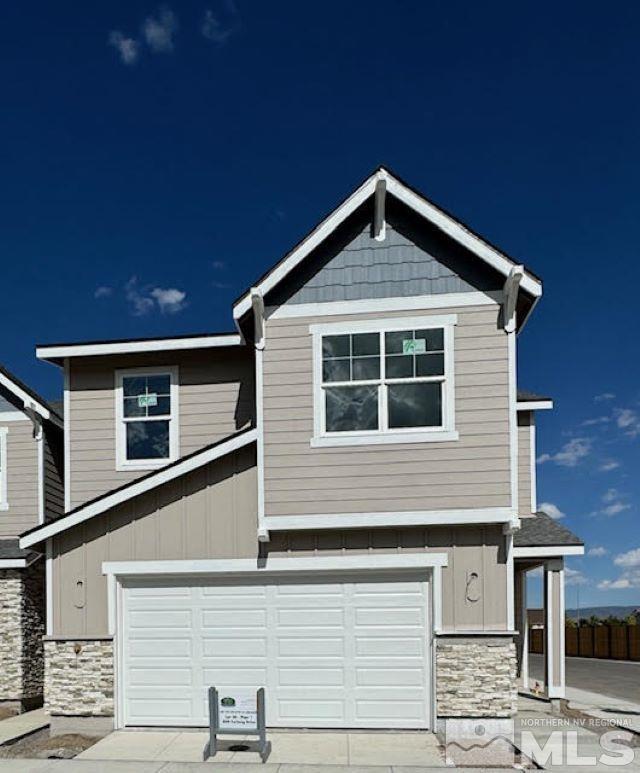 a front view of a house with garage