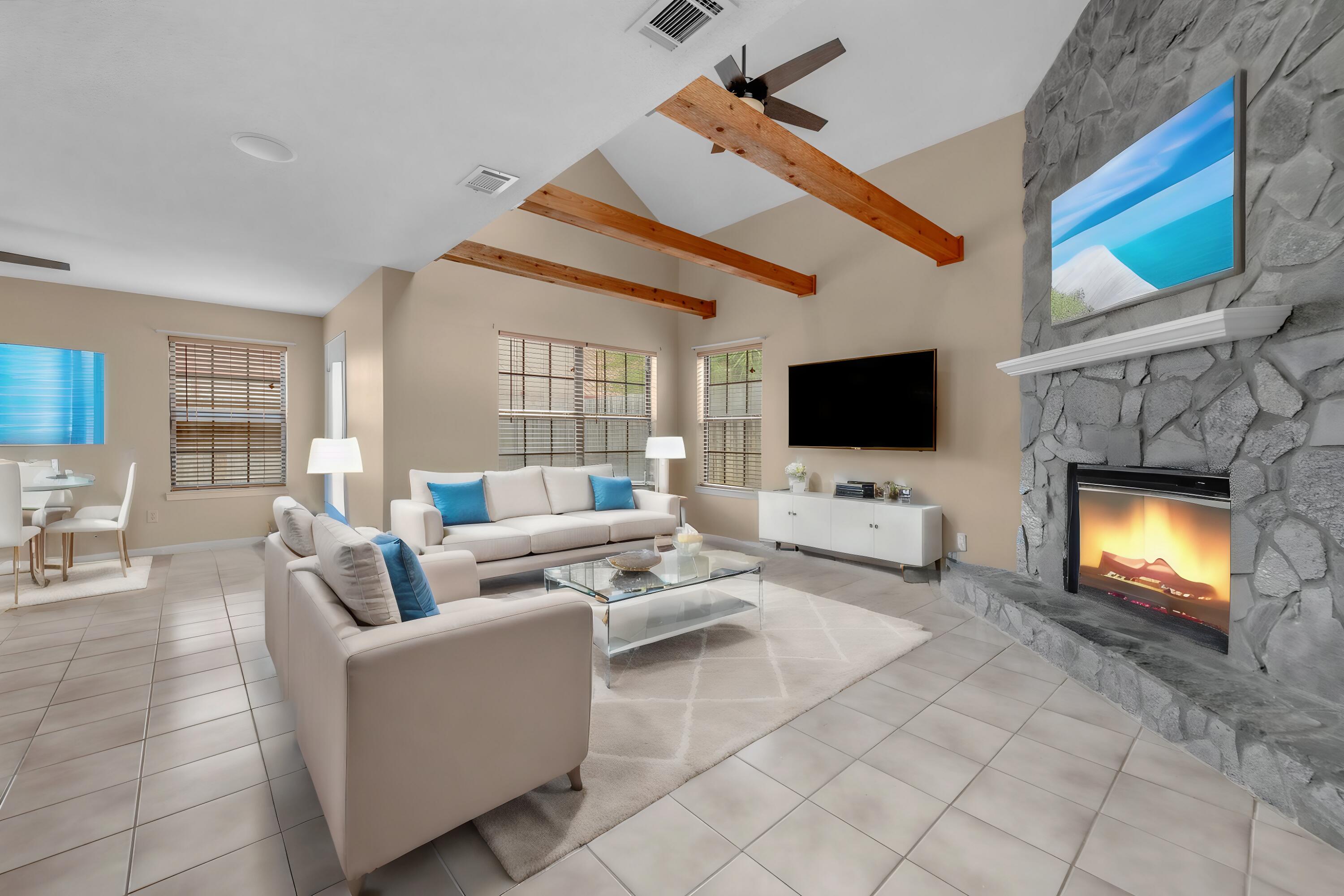 a living room with furniture and a flat screen tv