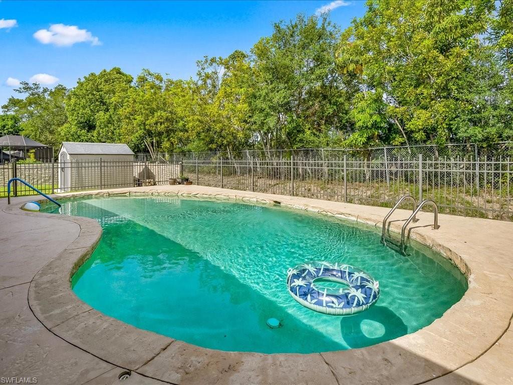 a view of a swimming pool with a patio