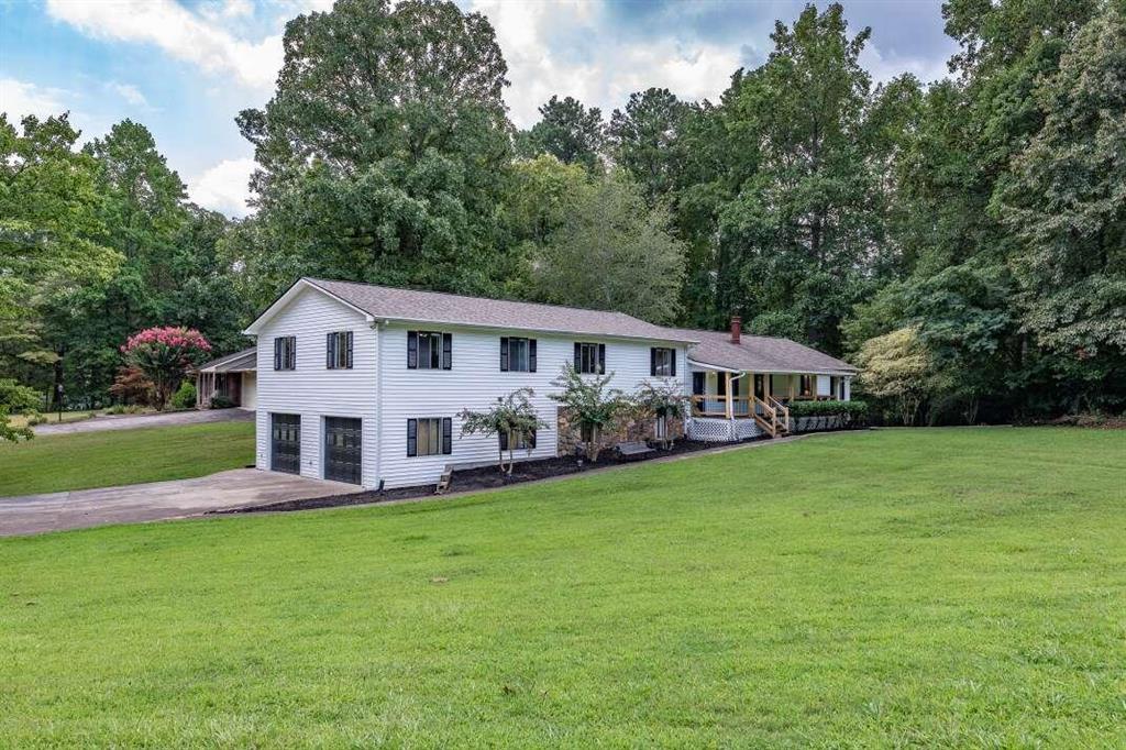 a view of a house with a big yard