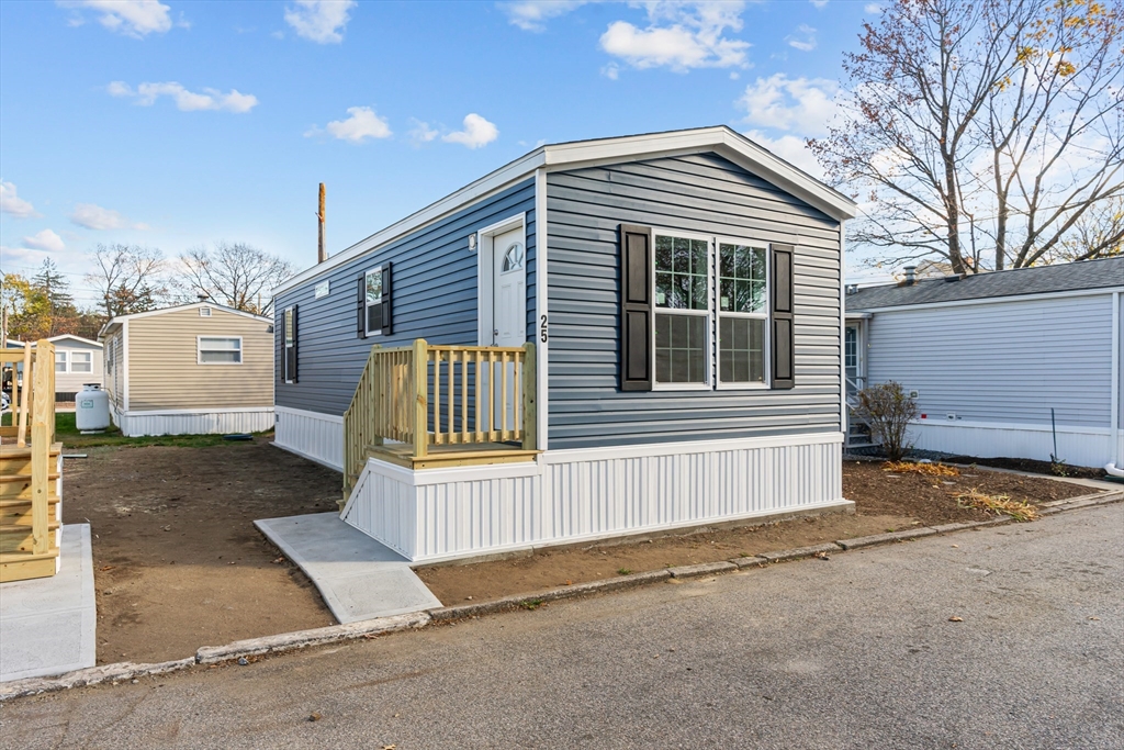 a view of a house with a yard and garage