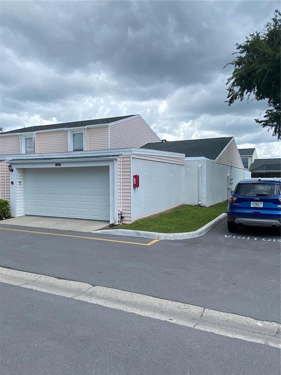 a view of a car parked front of a house