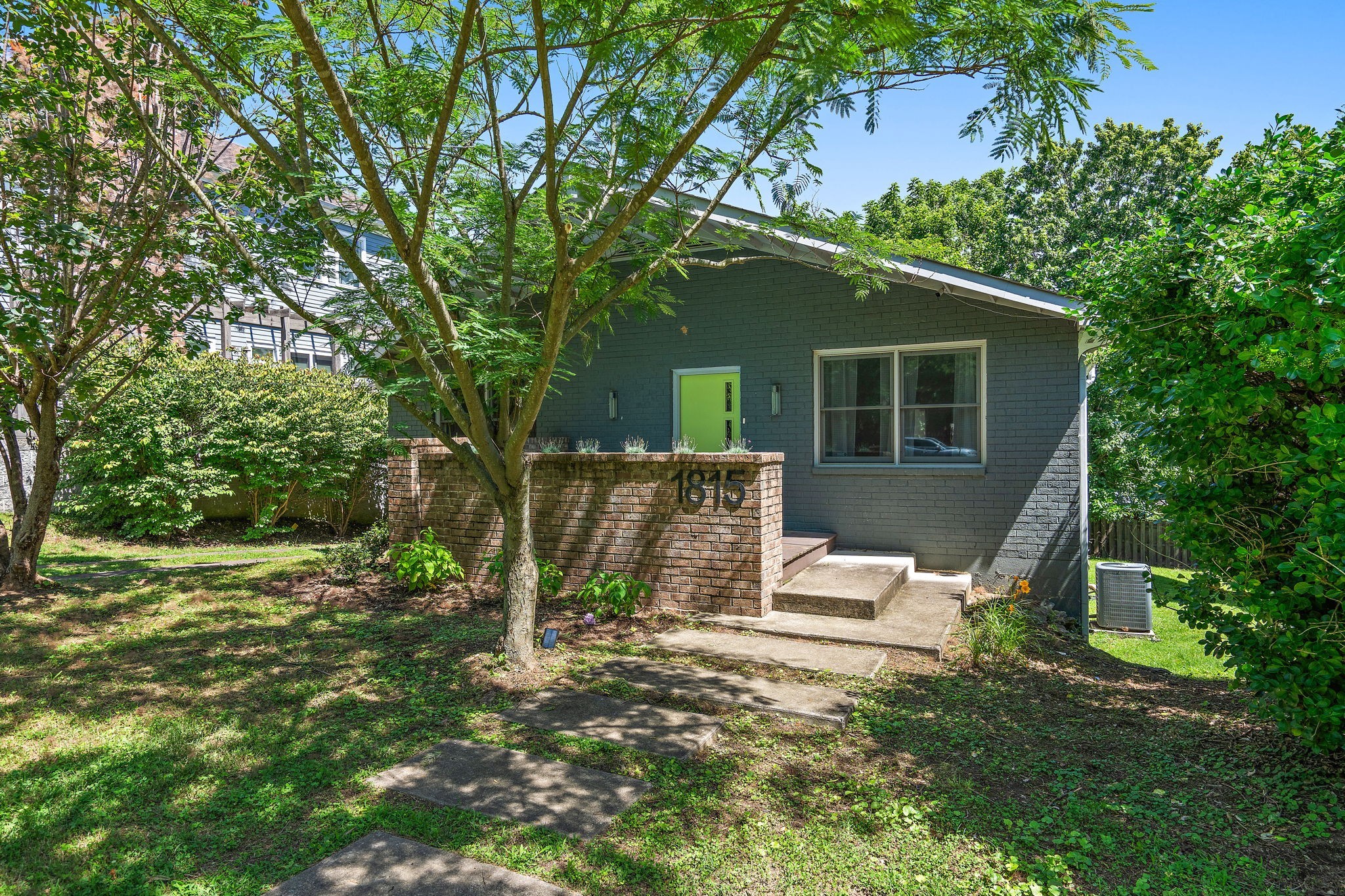 front view of a house with a yard