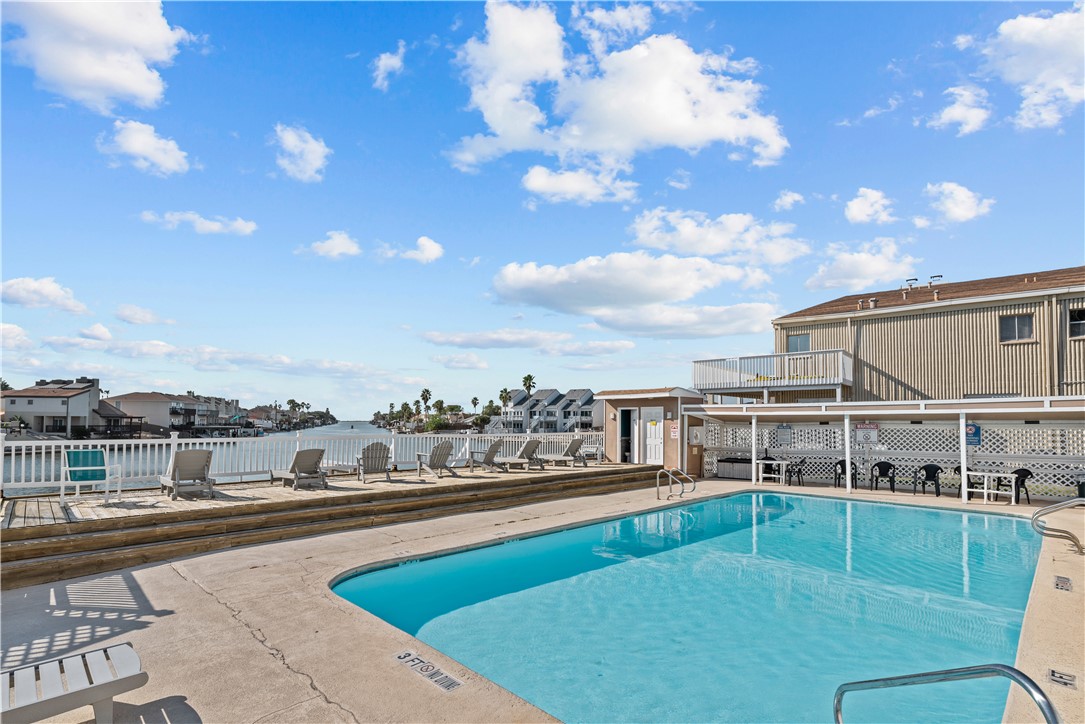 a view of a swimming pool with an outdoor seating