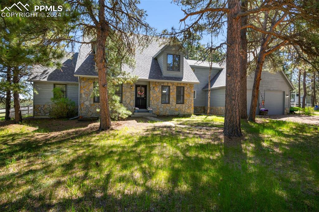 front view of a house with a yard