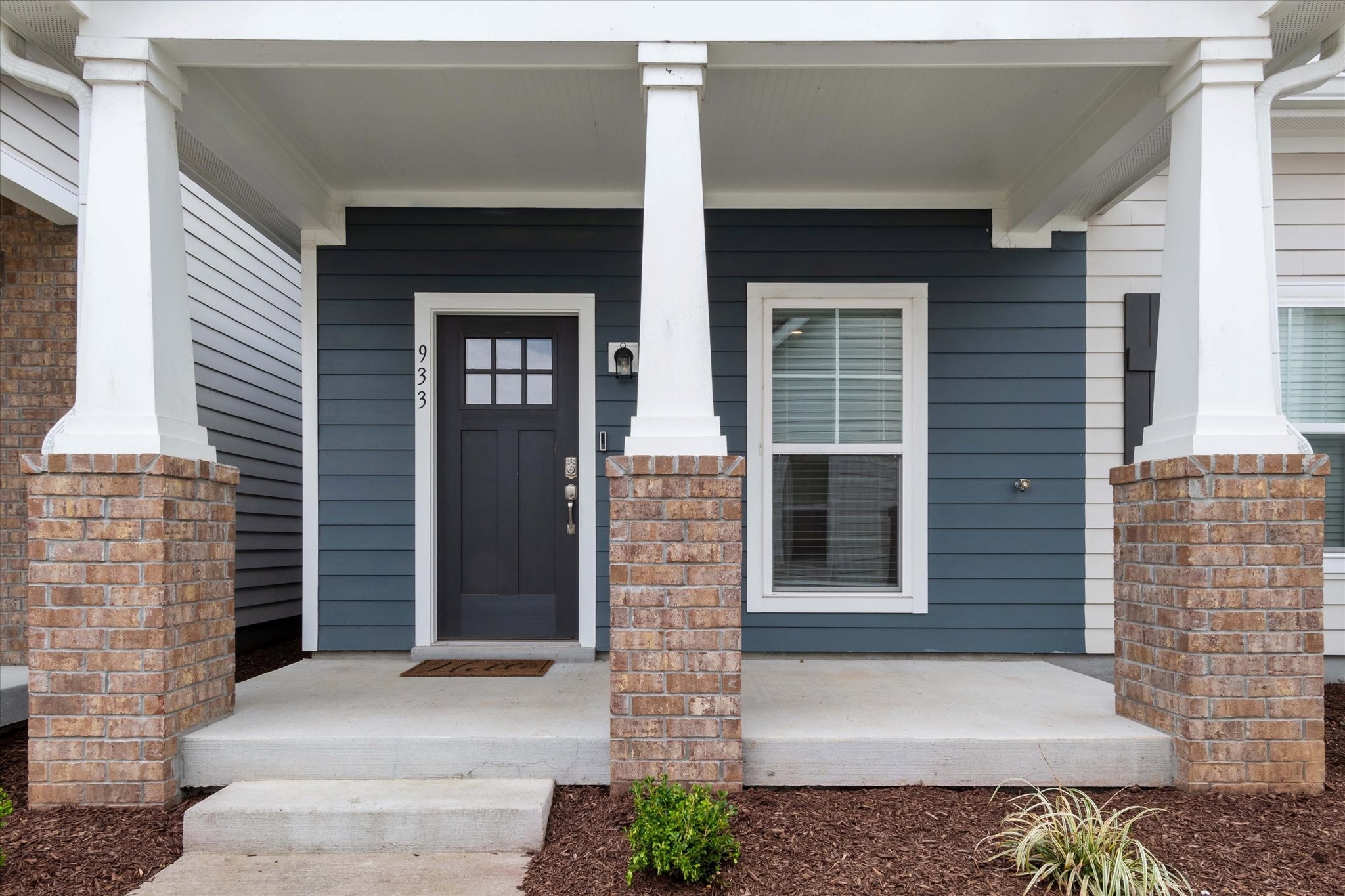 a front view of a house with a garage