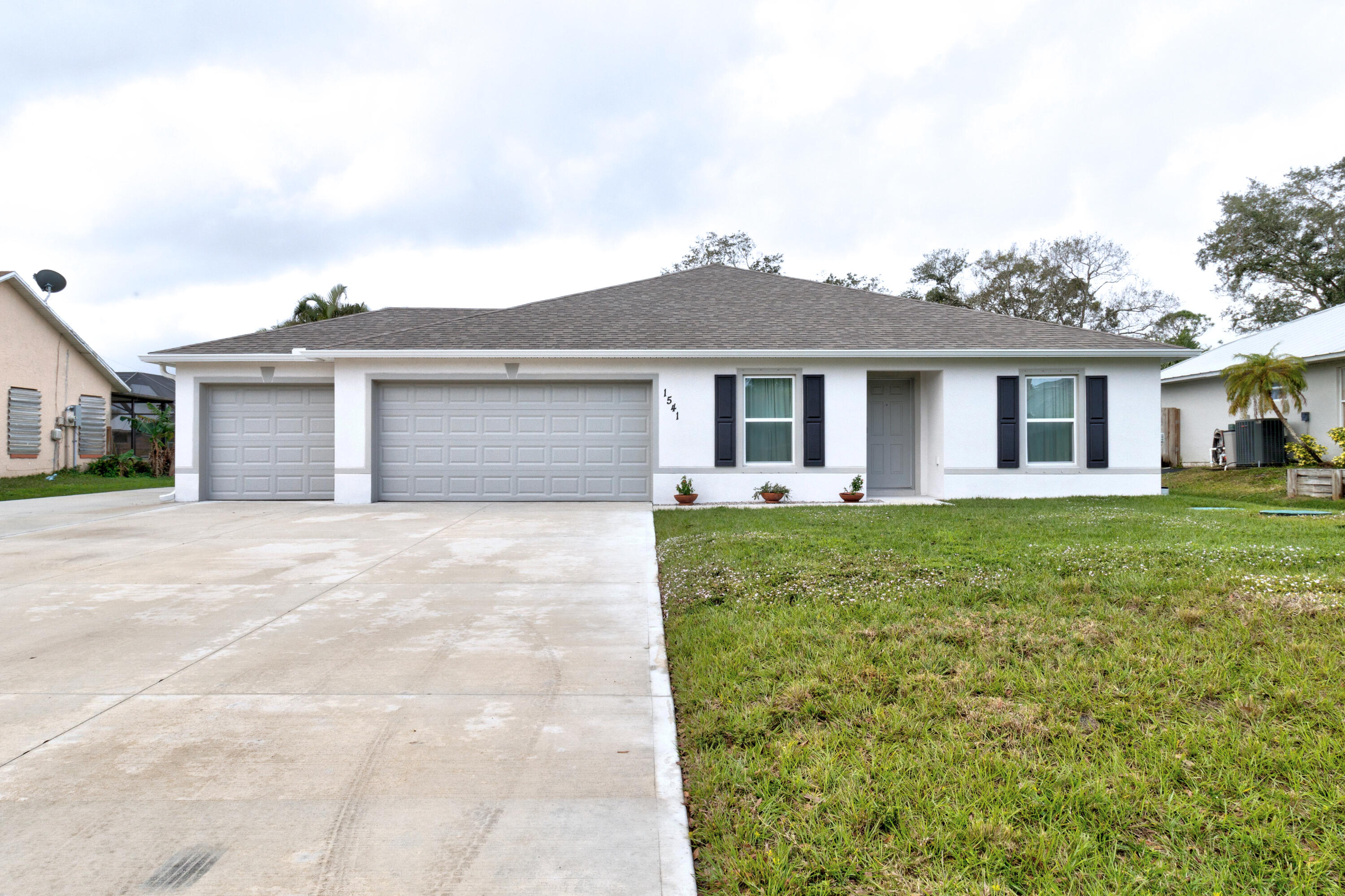 a front view of house with yard and green space