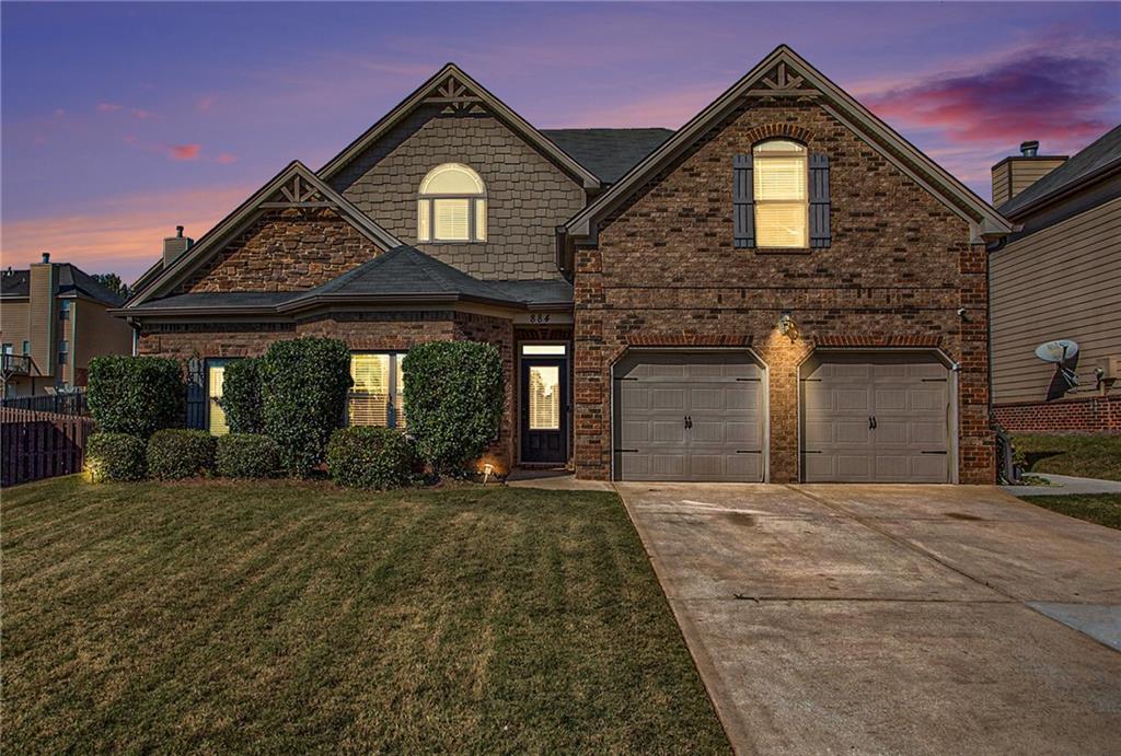 a front view of a house with a yard