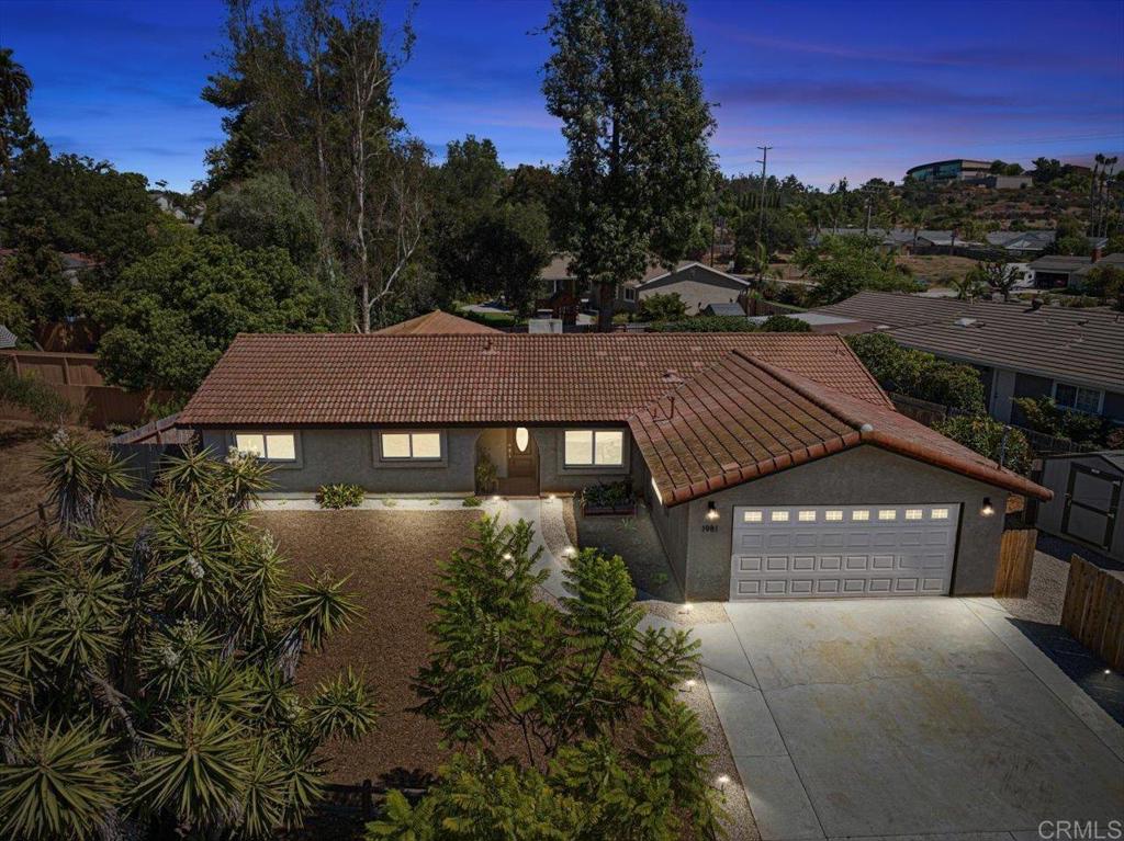 a view of a house with a yard