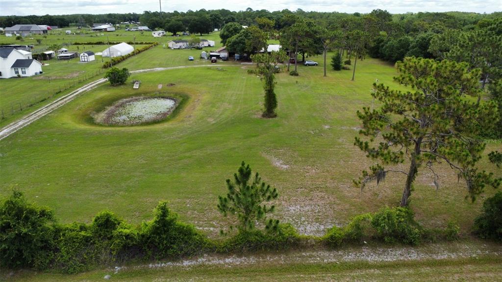 a view of a lake with a yard