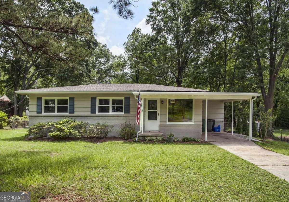 a front view of house with yard and green space