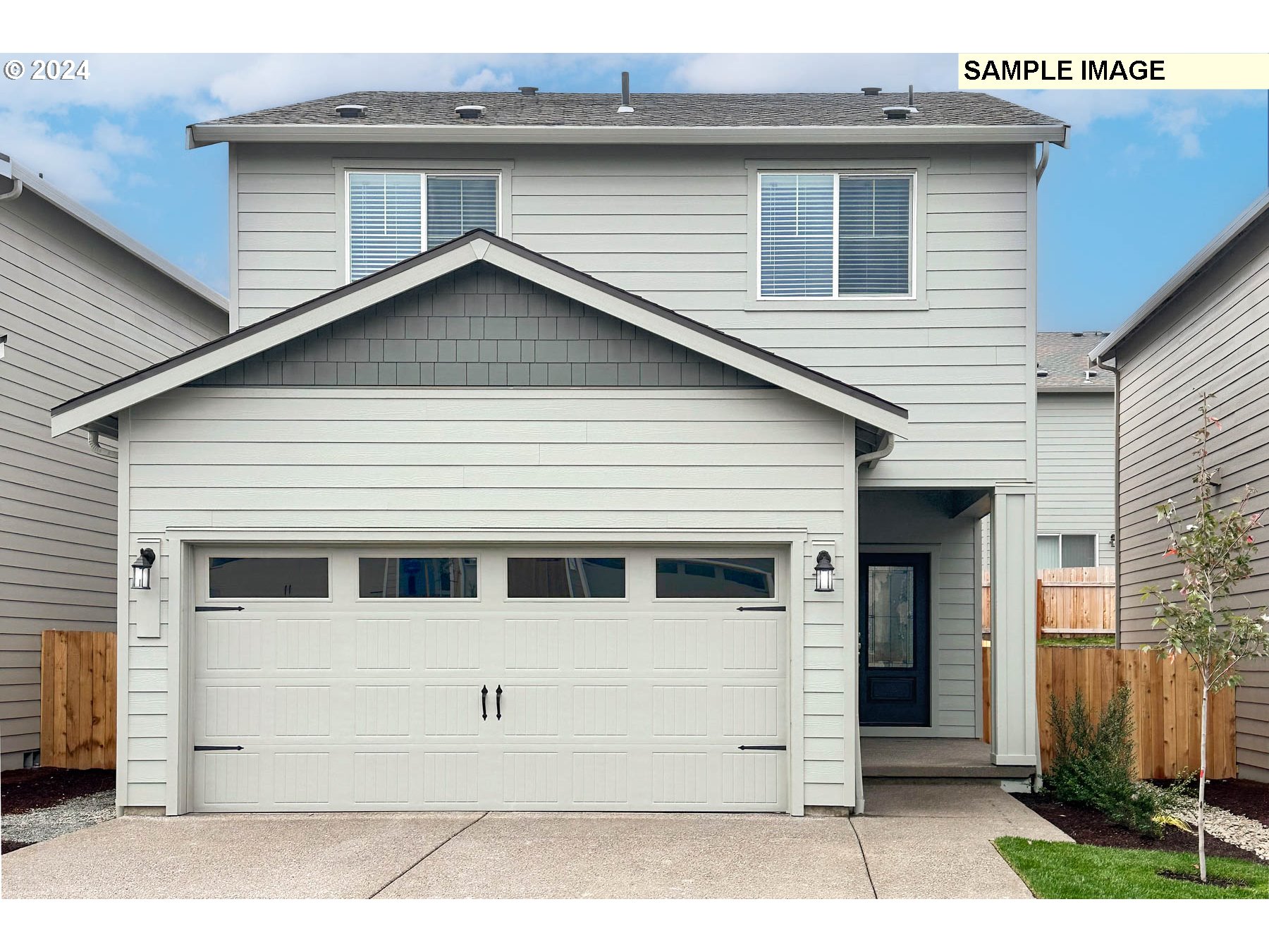 a view of house with garage