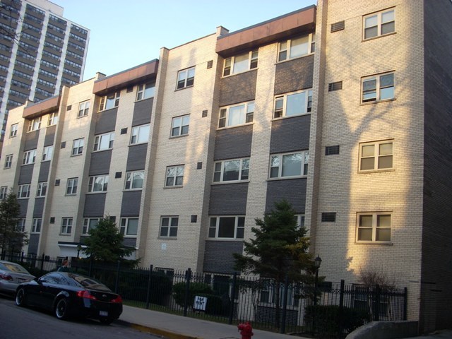 a view of a building and car parked