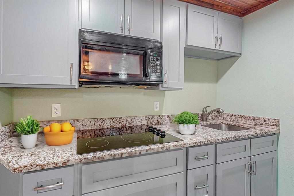 a kitchen with stainless steel appliances granite countertop a sink and cabinets