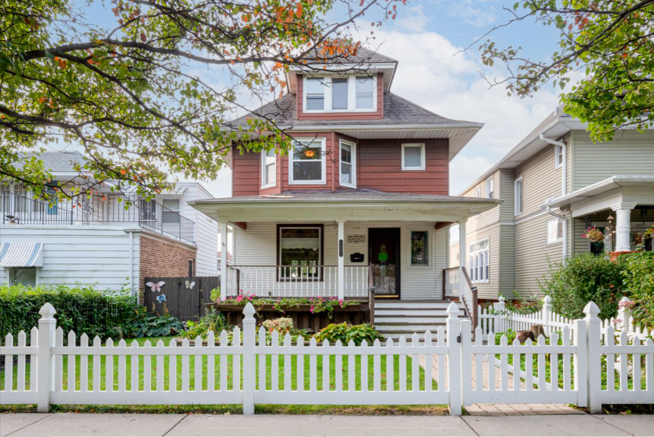 a front view of a house with a small yard