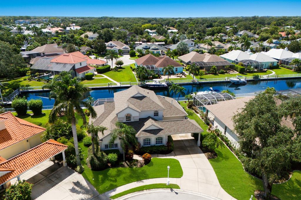 an aerial view of a house with a lake view