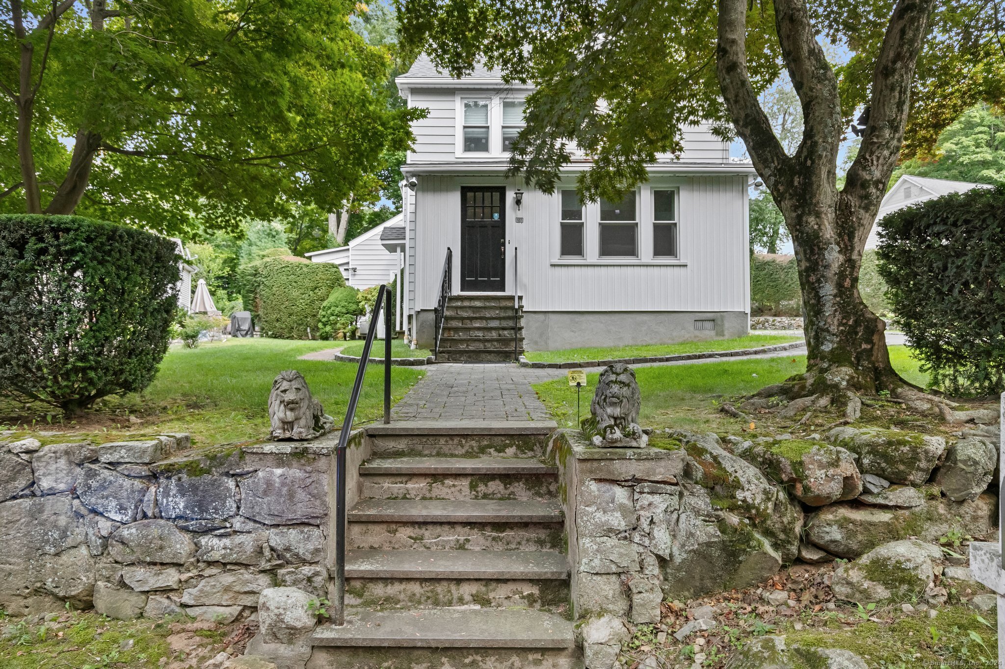 front view of a house with a yard