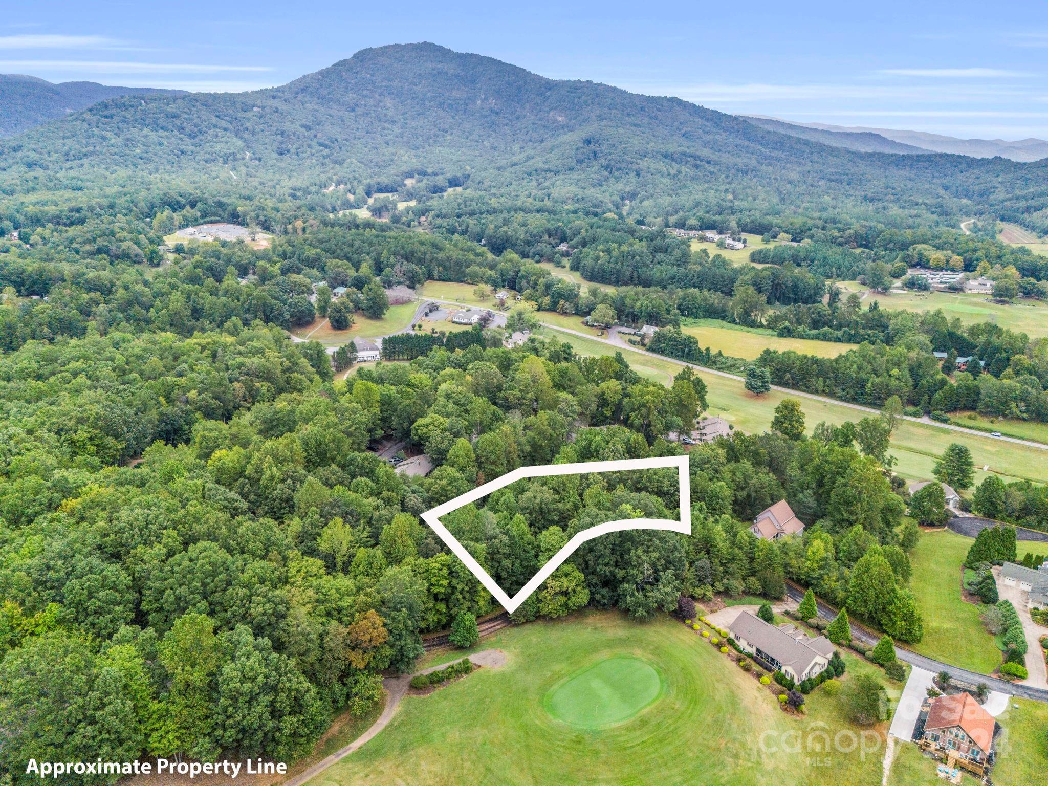 an aerial view of a house with a garden