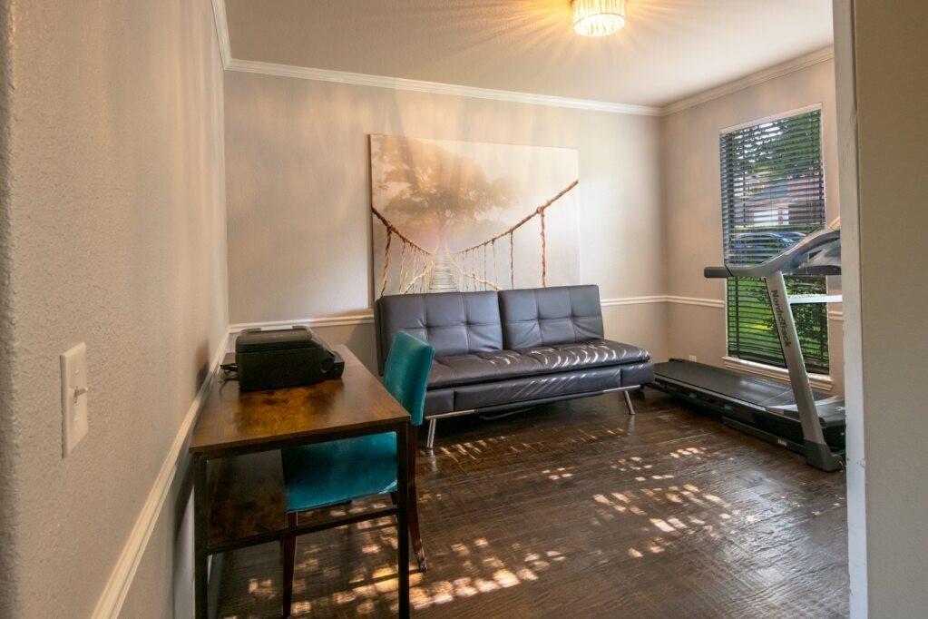 a living room with furniture and a window