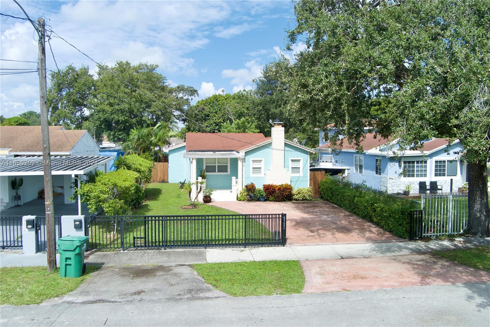 a front view of a house with a yard and porch